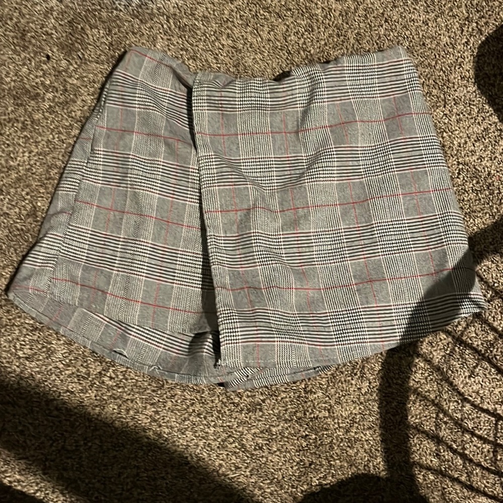 This is a plaid skort in a mainly grey color.